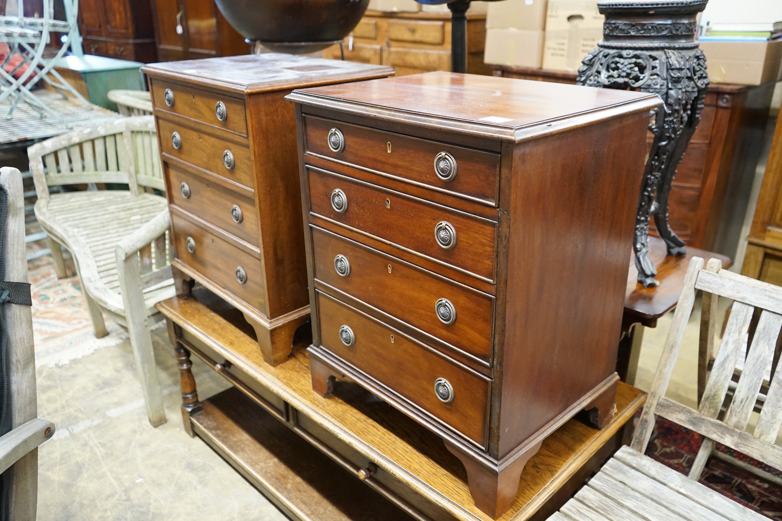 A pair of reproduction George III style mahogany bedside chests, width 56cm, depth 43cm, height 70cm